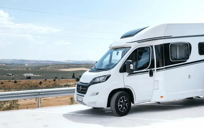 Modern motorhome parked in rural Spain for campervan travel and road trips