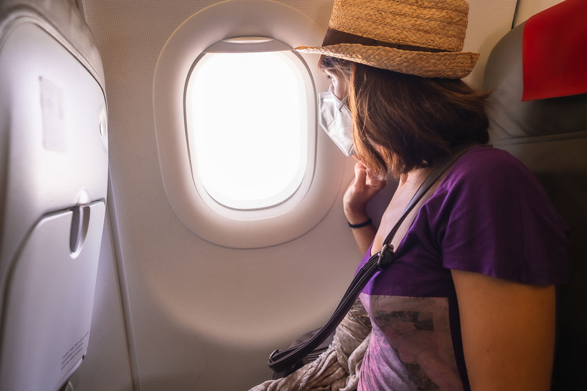 Passenger looking out of airplane window