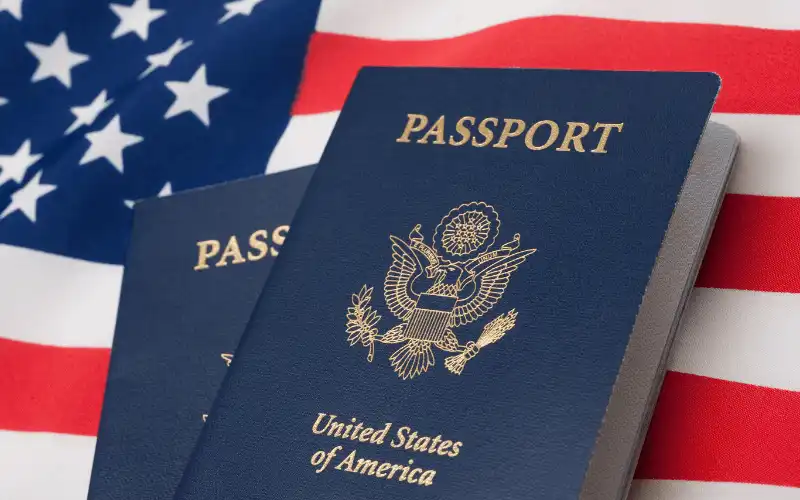 United States passports on American flag representing U.S. citizens applying for Spanish residency