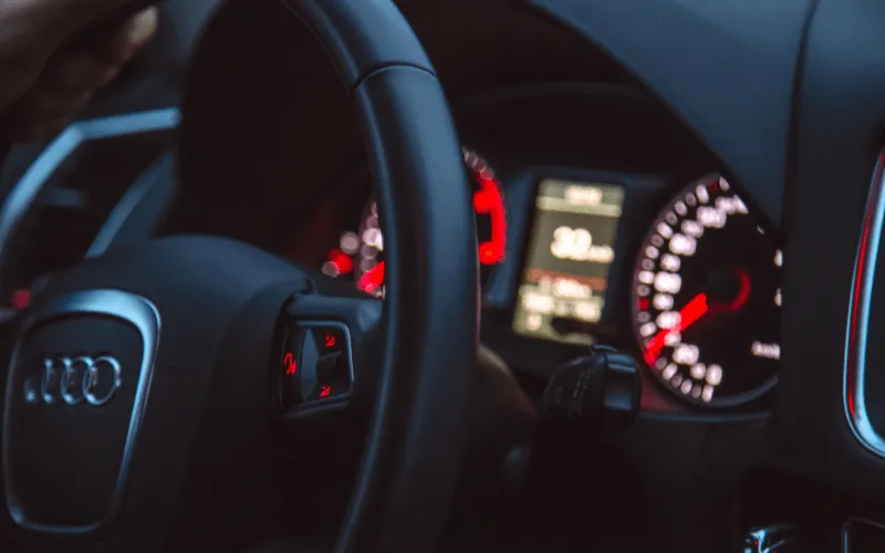 Close-up of Audi steering wheel and dashboard at night