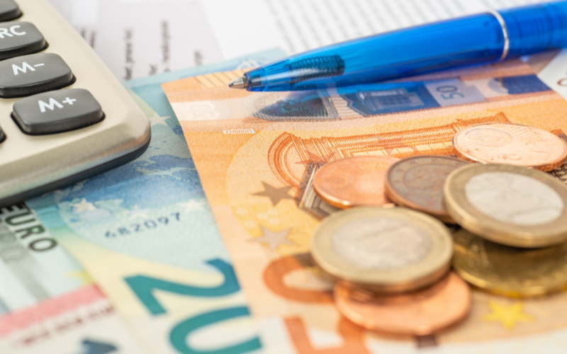 money pen and calculating spains social security