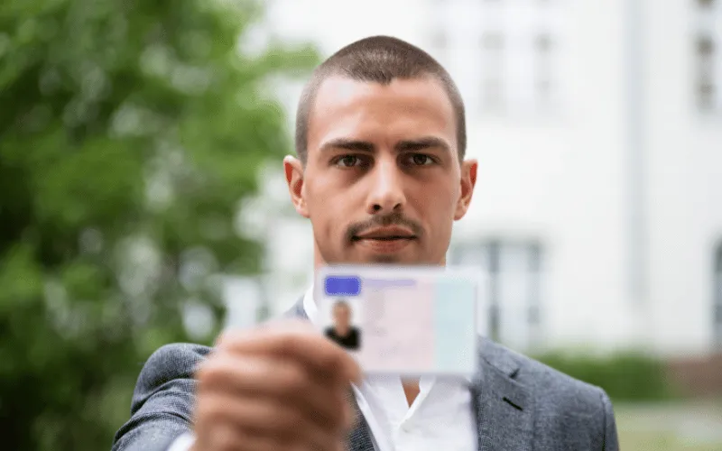 Man showing European ID card for identification in Spain