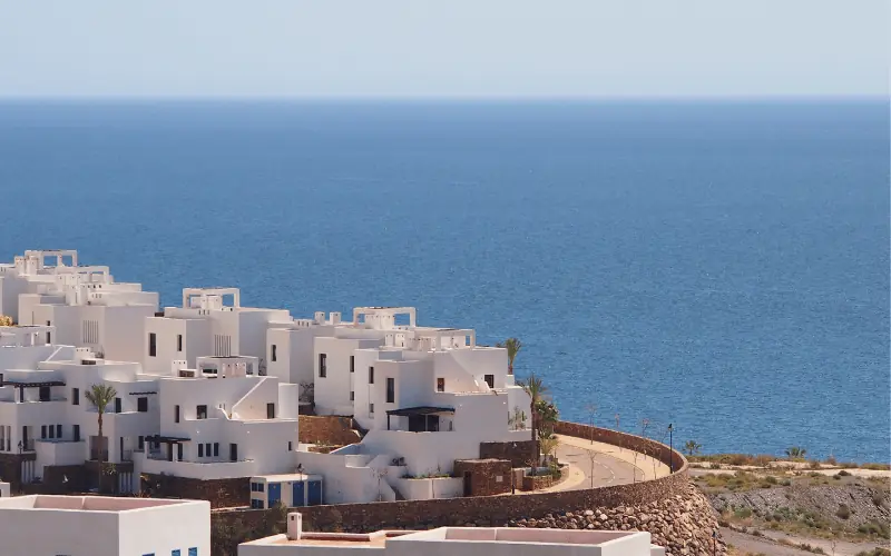 Modern white coastal homes in Spain overlooking the Mediterranean Sea