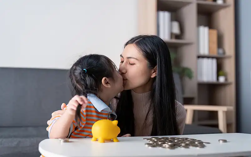 Mother and daughter counting their pennies