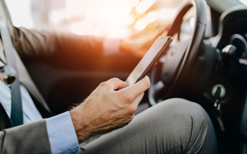Driver holding mobile phone
