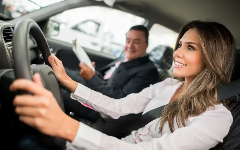 Young woman taking a driving test
