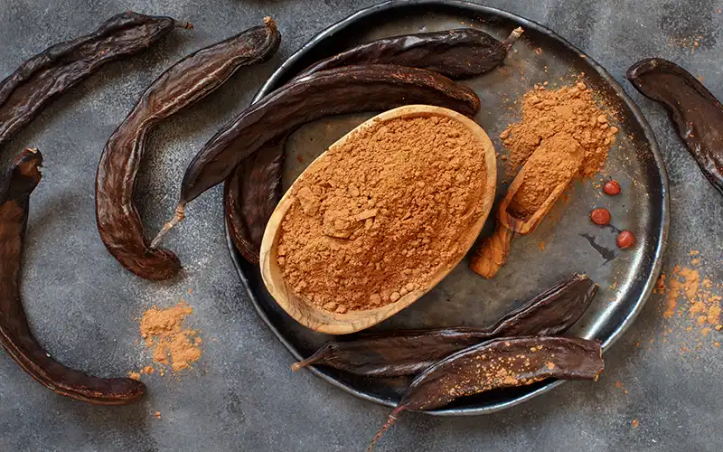 Dried carob pods and chocolate powder