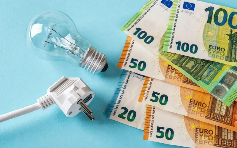 Euro banknotes with light bulb and plug symbolizing electricity cost in Spain