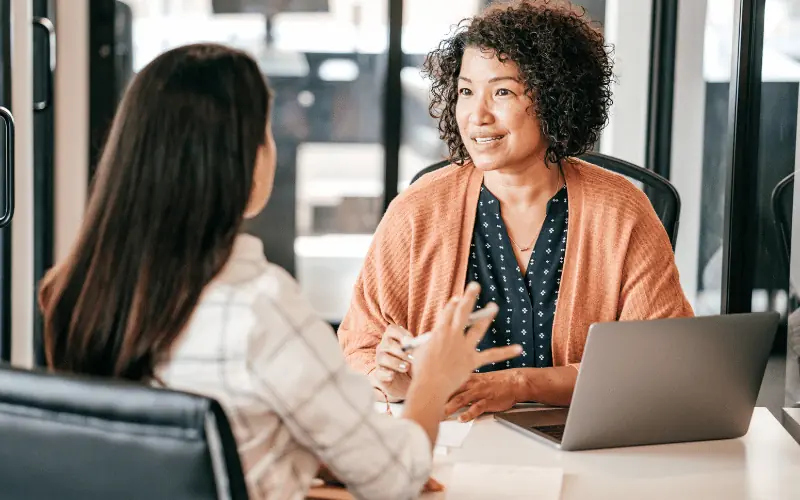 HR professional discussing job opportunities during employment interview