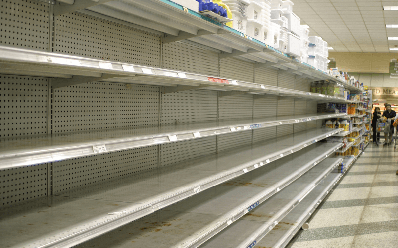Empty food shelves in a supermarket