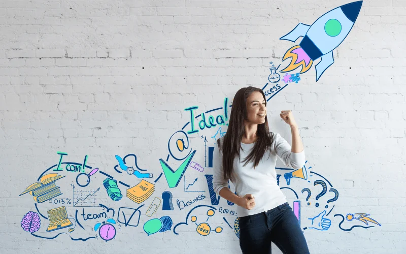 Excited young entrepreneur celebrating startup success with creative business doodles