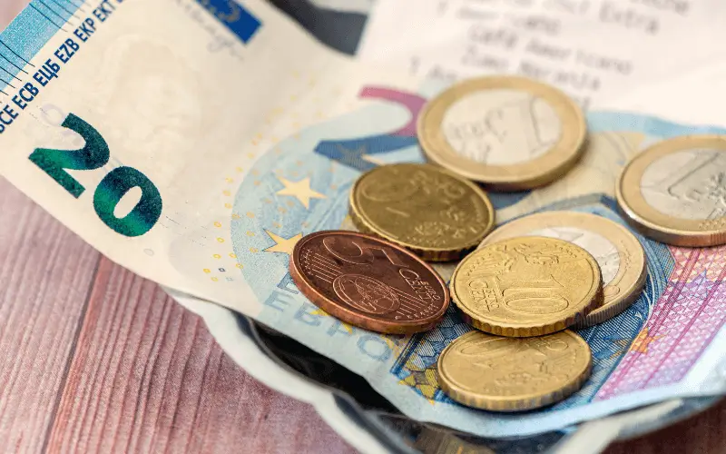 Euro coins and tips with receipt