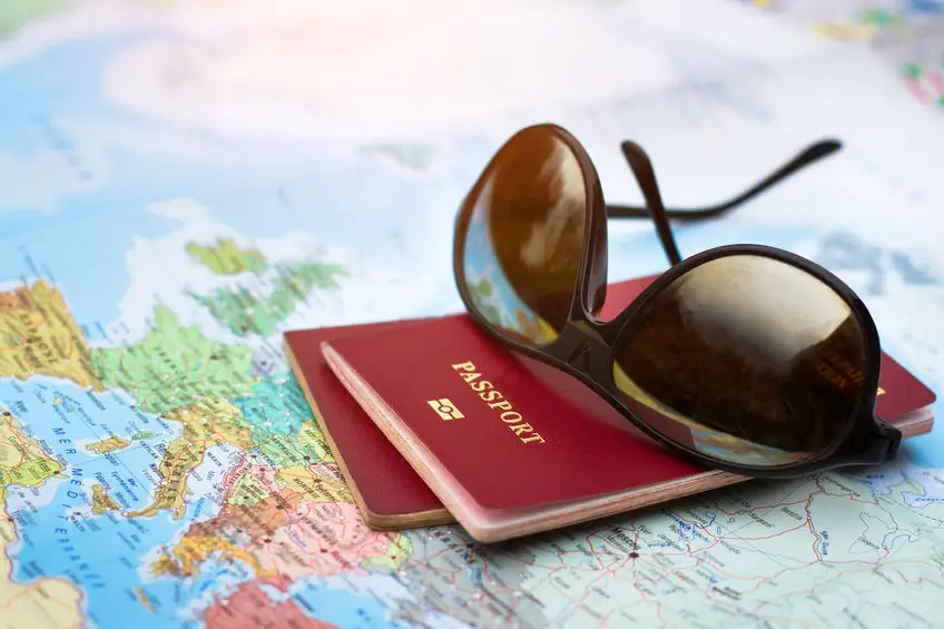 Sunglasses, passport and map