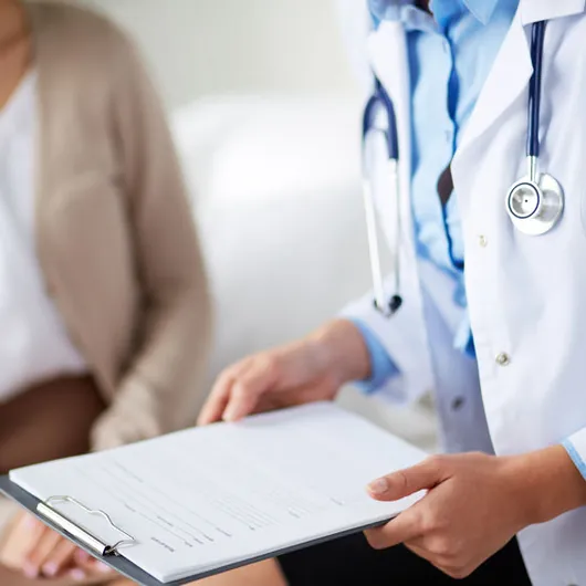 Doctor going through a patient's medical history