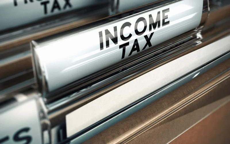Filing cabinet with income tax slot
