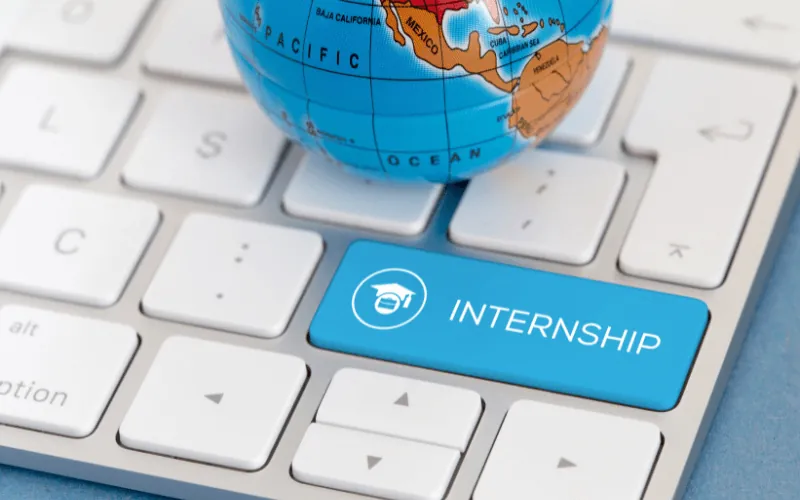 Internship application concept with keyboard and globe representing global student opportunities