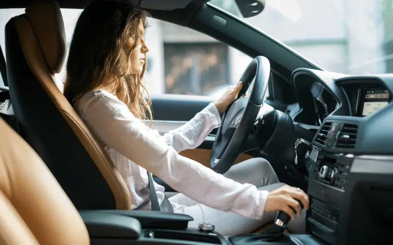 Woman driving car focused on road safety awareness