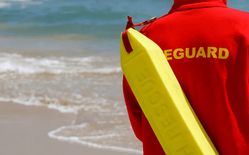 Lifeguard on duty at a beach in Spain with rescue equipment