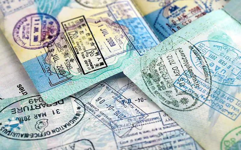 Traditional whitewashed village street in southern Spain with mosaic steps and flowers
