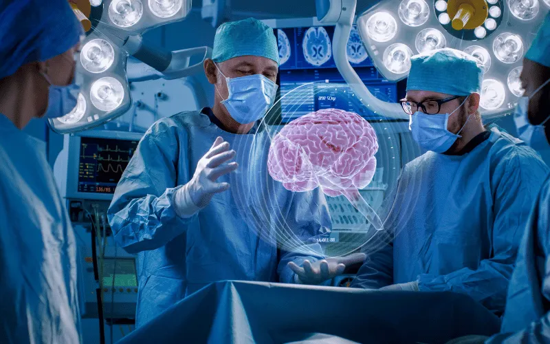 Neurosurgeons using advanced technology during brain surgery in modern operating room