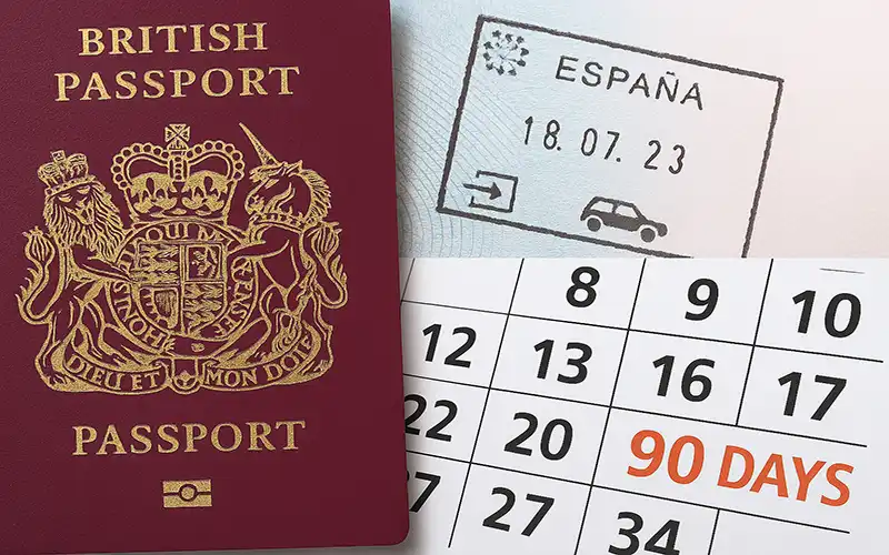 UK passport with Spain entry stamp and calendar showing 90-day limit