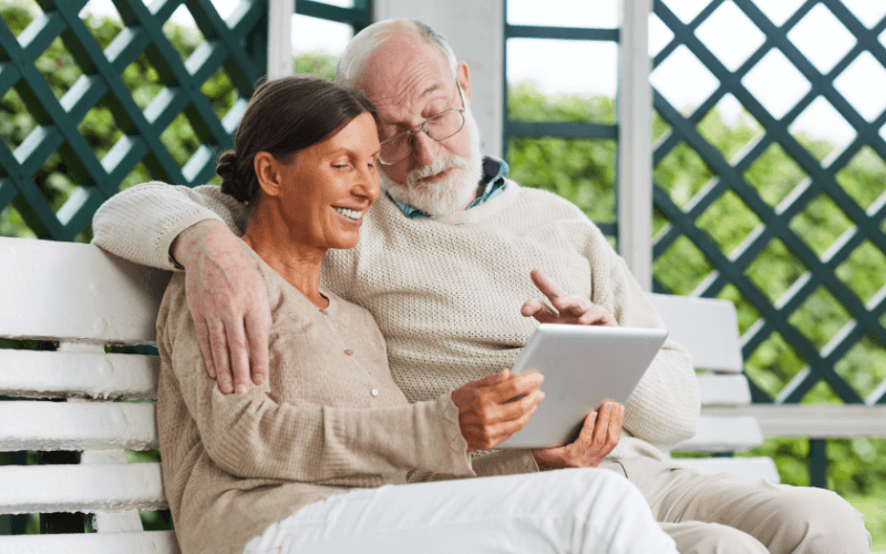 Pensioners looking at tablet computer