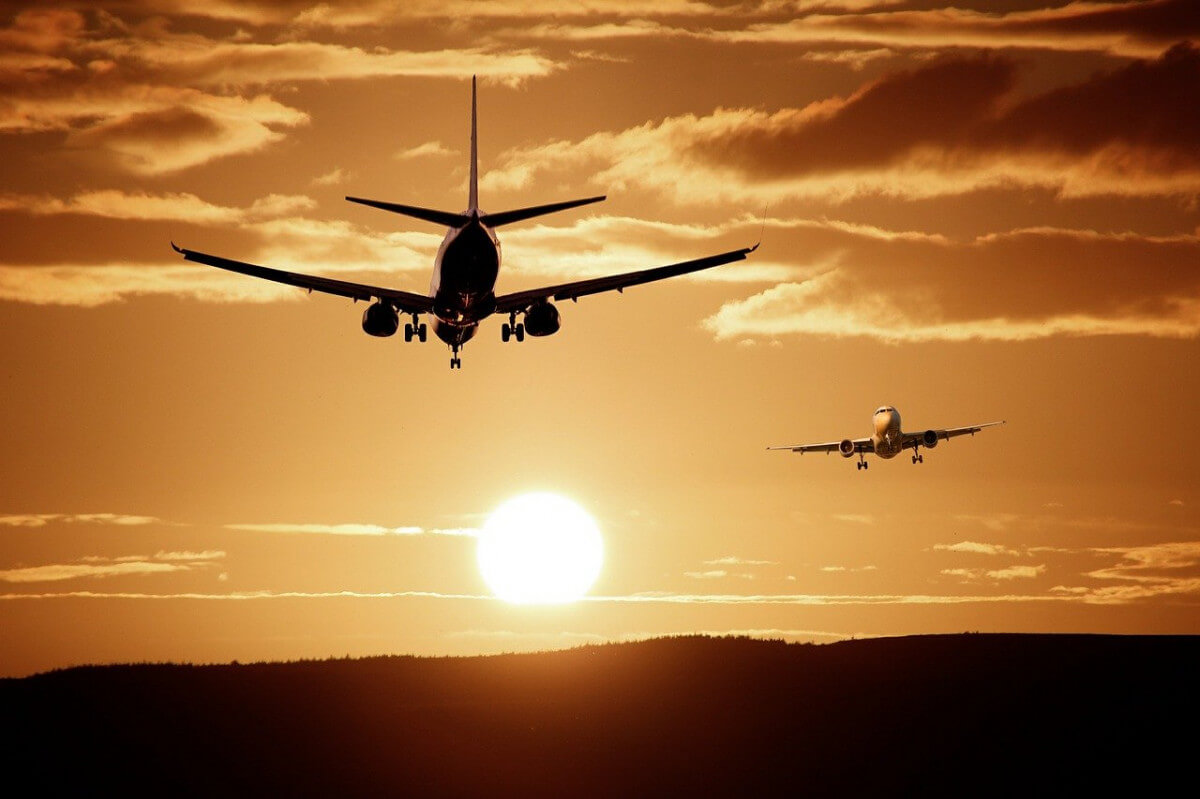 Planes in sky with sun