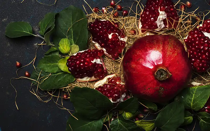 Vibrant pomegranate on kitchen table