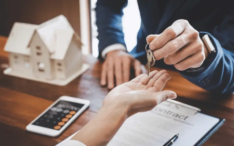 Tenant being handed keys by agent