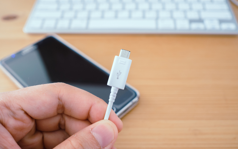 Smartphone with user holding charger