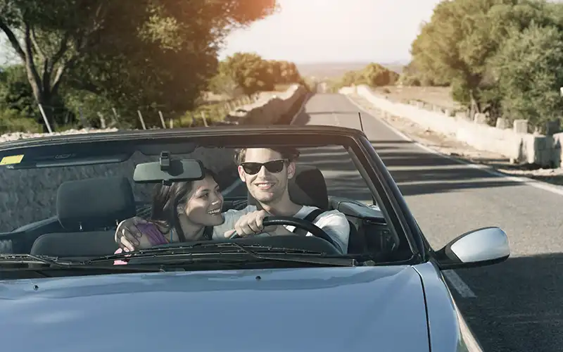Young American couple driving in the Spanish countryside