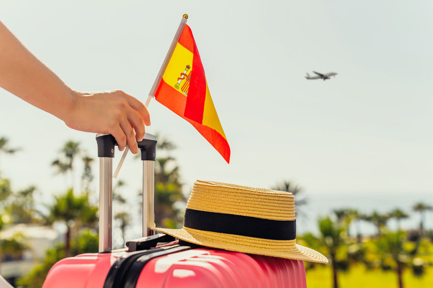 Spanish flag with suitcase