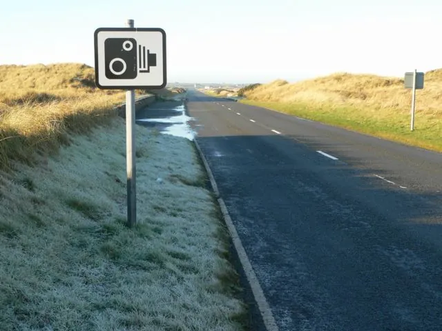 Speed camera warning sign on rural road in Spain