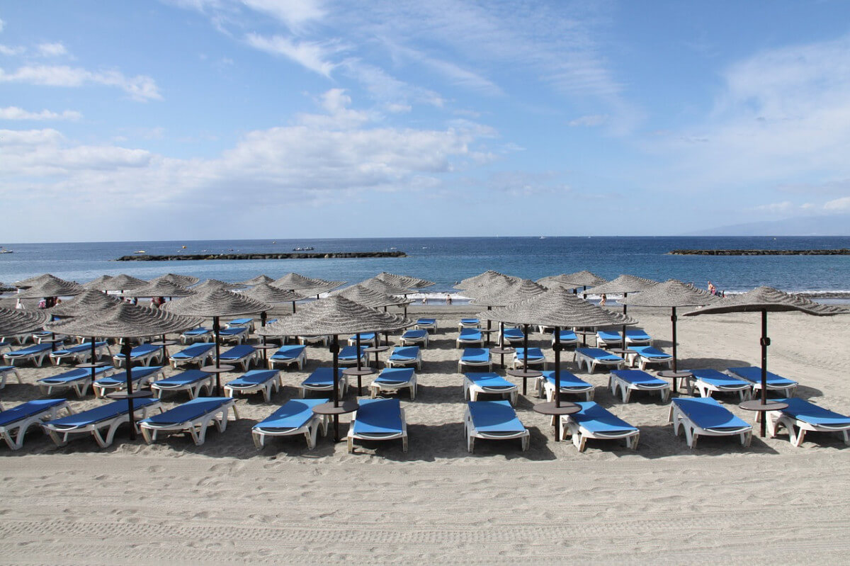 Empty beach sunbeds Spain
