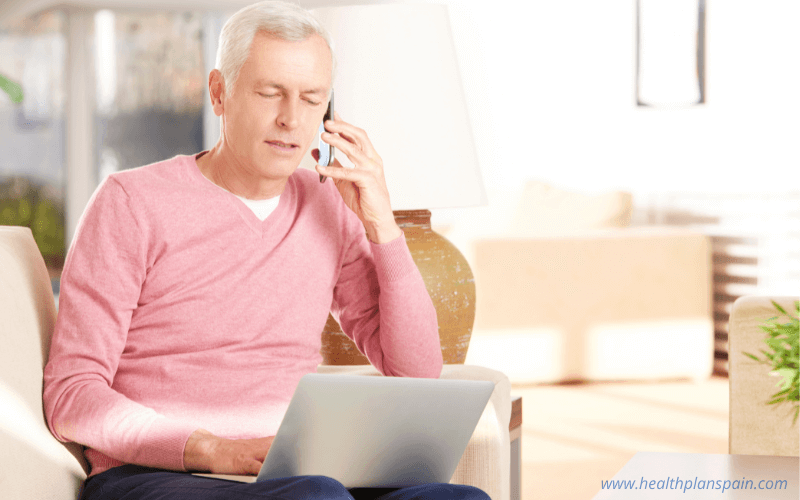 Man doing telephone banking