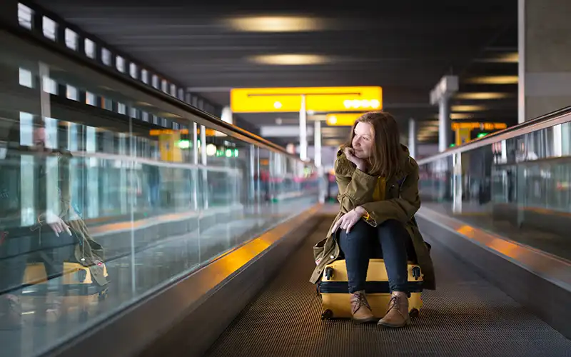 girl riding the travolator at gatwick airport